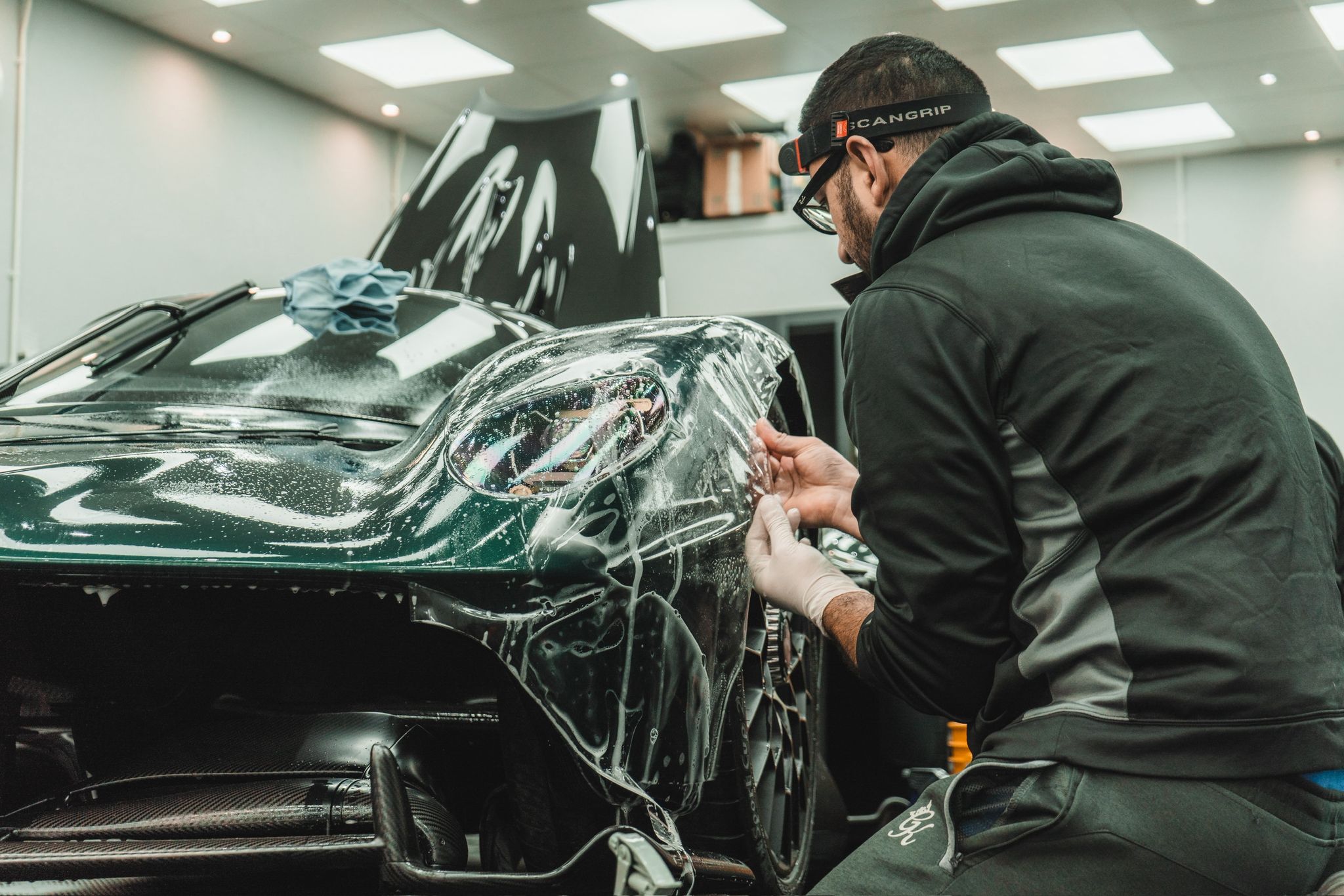 Man detailing supercar in Glasgow
